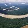 Aerial photo of the Amazon River winding through the Amazon Rainforest