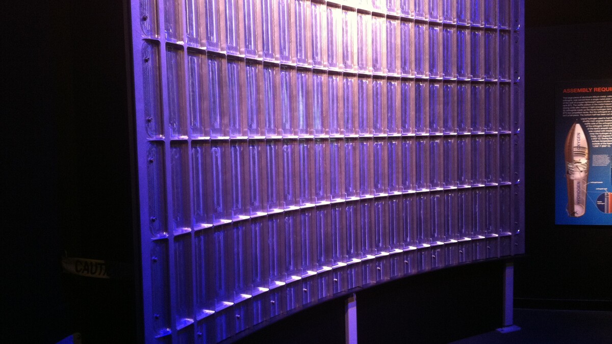 A large, shiny metal orthogrid, covered in carved out rectangle shapes