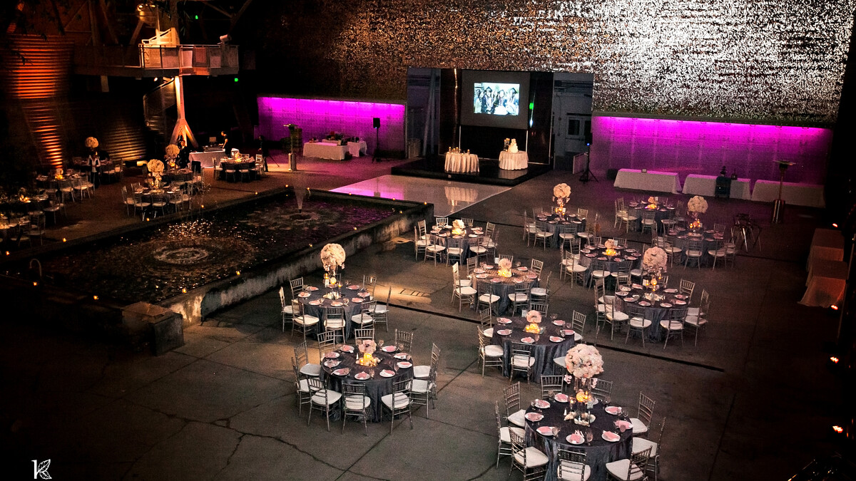 Wallis Annenberg Building Big Lab set formally with round dining tables for an evening wedding reception