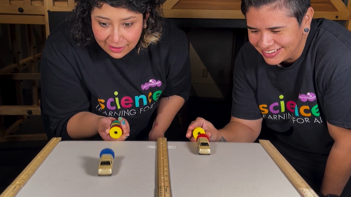 Educators experimenting with magnets and toy cars