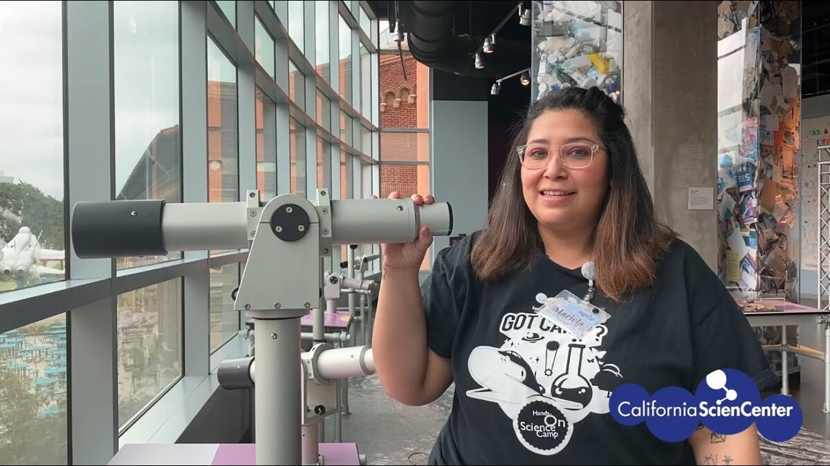 Educator Mariela using telescope in LA Zone