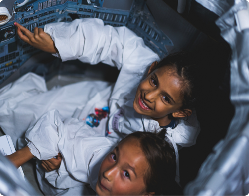 Two girls in a spaceshuttle